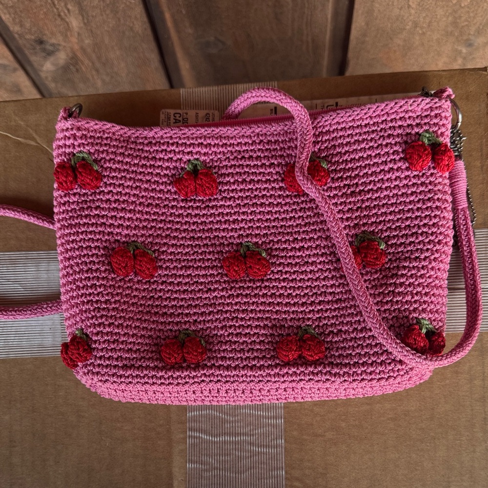 Pink Crochet Cherry Crossbody Bag  by the sak